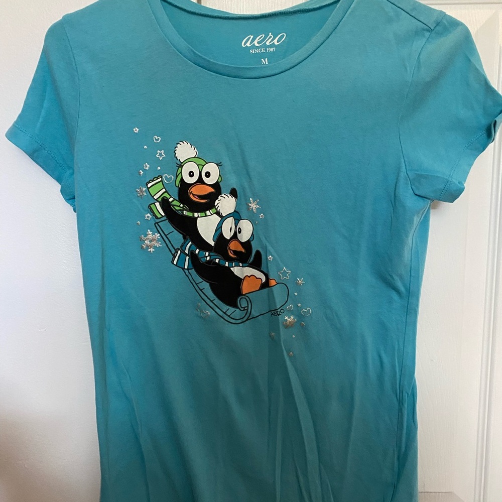 Medium size penguin pajama shirt.